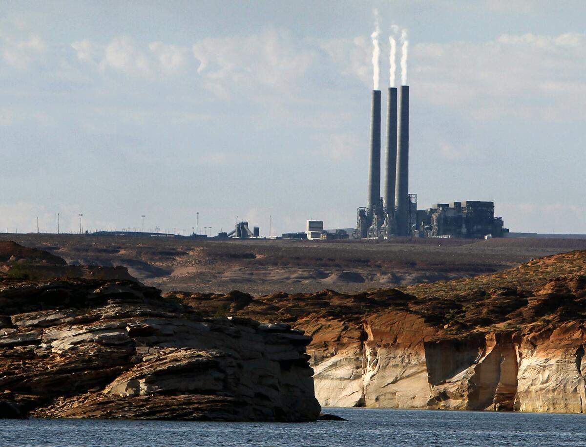 The Navajo Generating Station coal power plant, as seen from Lake Powell in Page, Ariz.