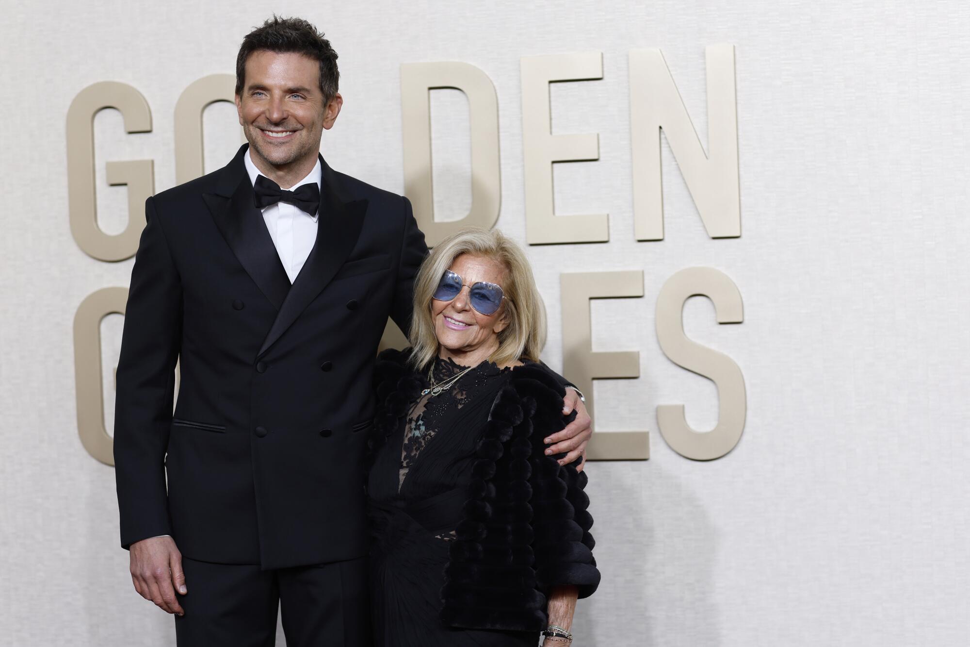 Bradley Cooper and Gloria Campano on the red carpet of the 81st Annual Golden Globe Awards