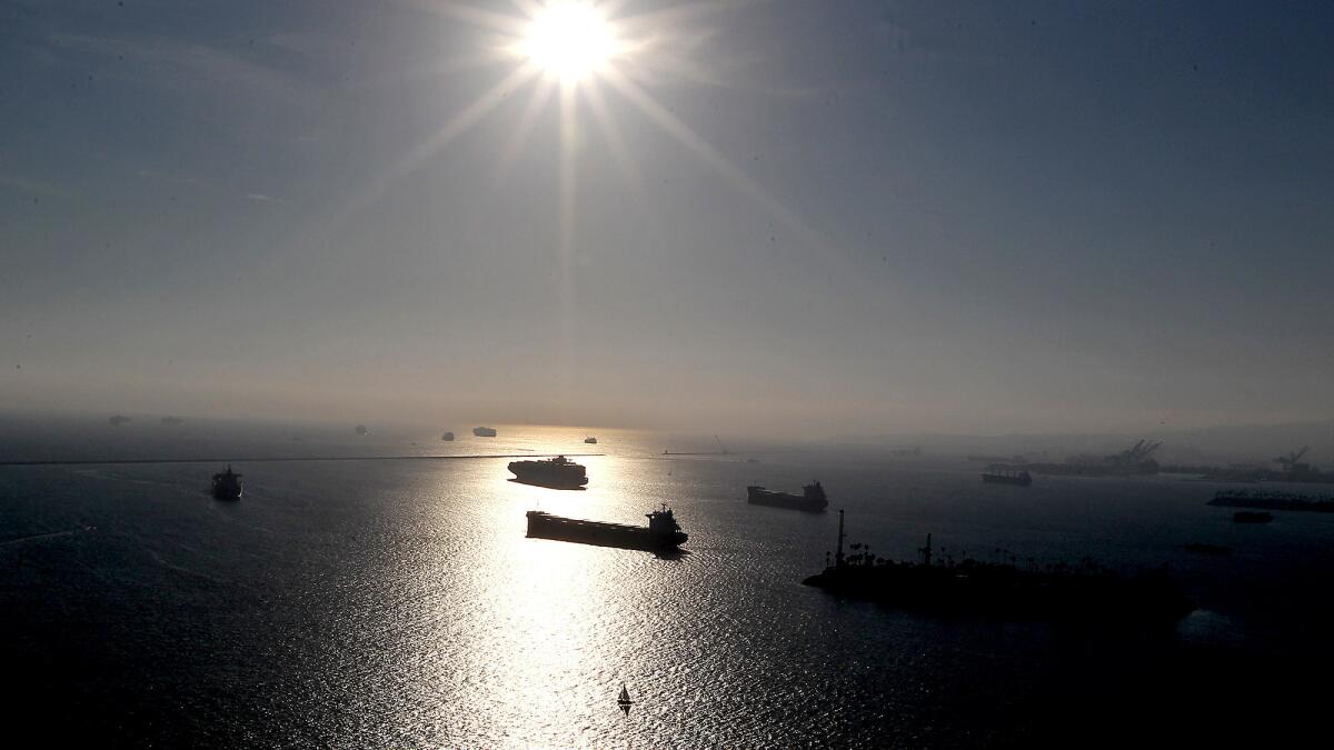 Cargo ships wait outside L.A. and Long Beach ports during a 2015 work stoppage. U.S. sales plummeted 40-50% for Asian imports in April.