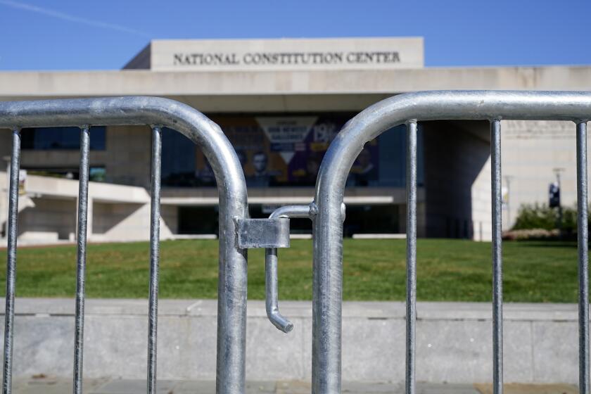 Barricades line the sidewalk in front of the National Constitution Center before an evening Town Hall by Democratic presidential candidate former Vice President Joe Biden, Thursday, Oct. 15, 2020, in Philadelphia. (AP Photo/Matt Slocum)