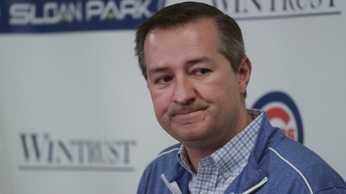 Chicago Cubs chairman Tom Ricketts answers questions during a news conference Monday in Mesa, Ariz.