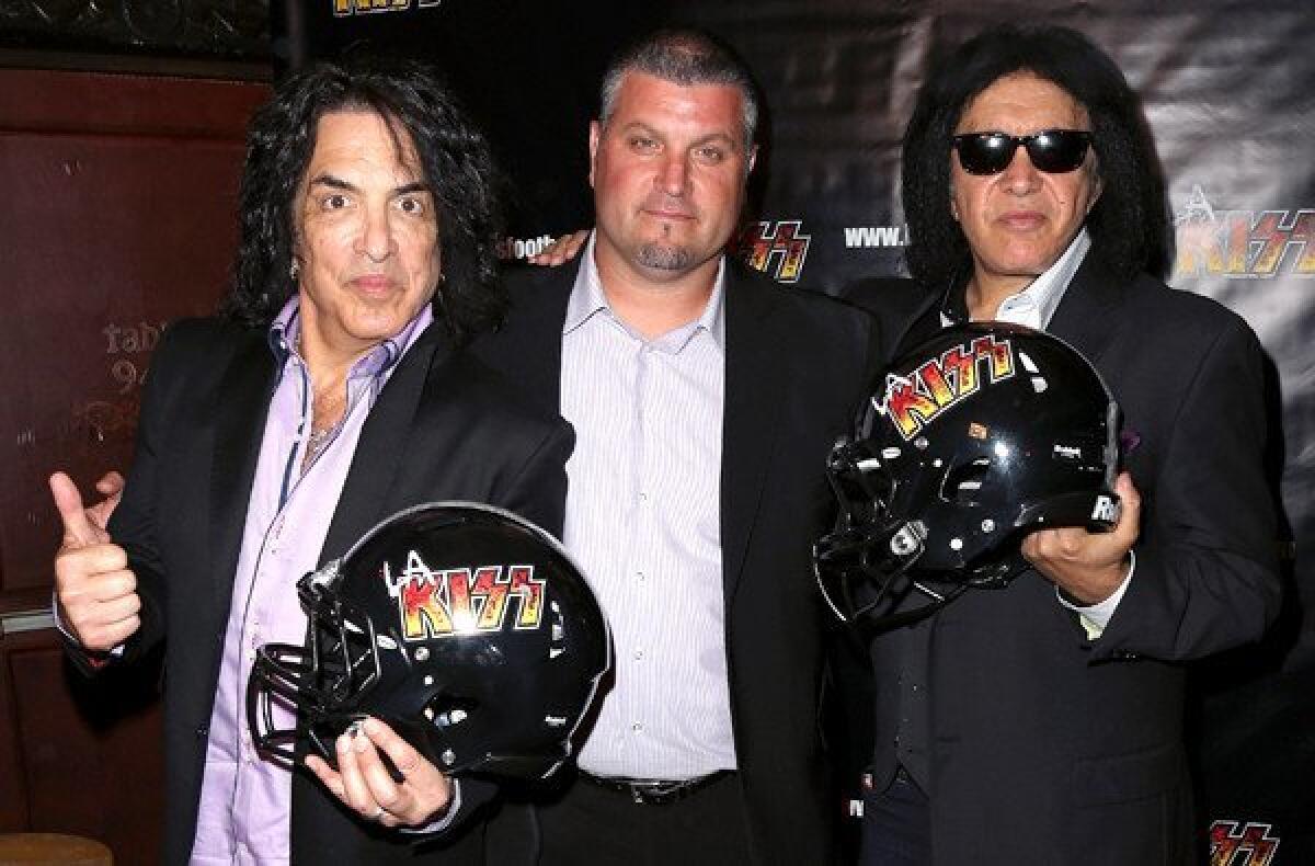 Paul Stanley, left, and Gene Simmons flank Bob McMillen, head coach of the L.A. KISS arena football team, at the House of Blues Sunset Strip in West Hollywood.