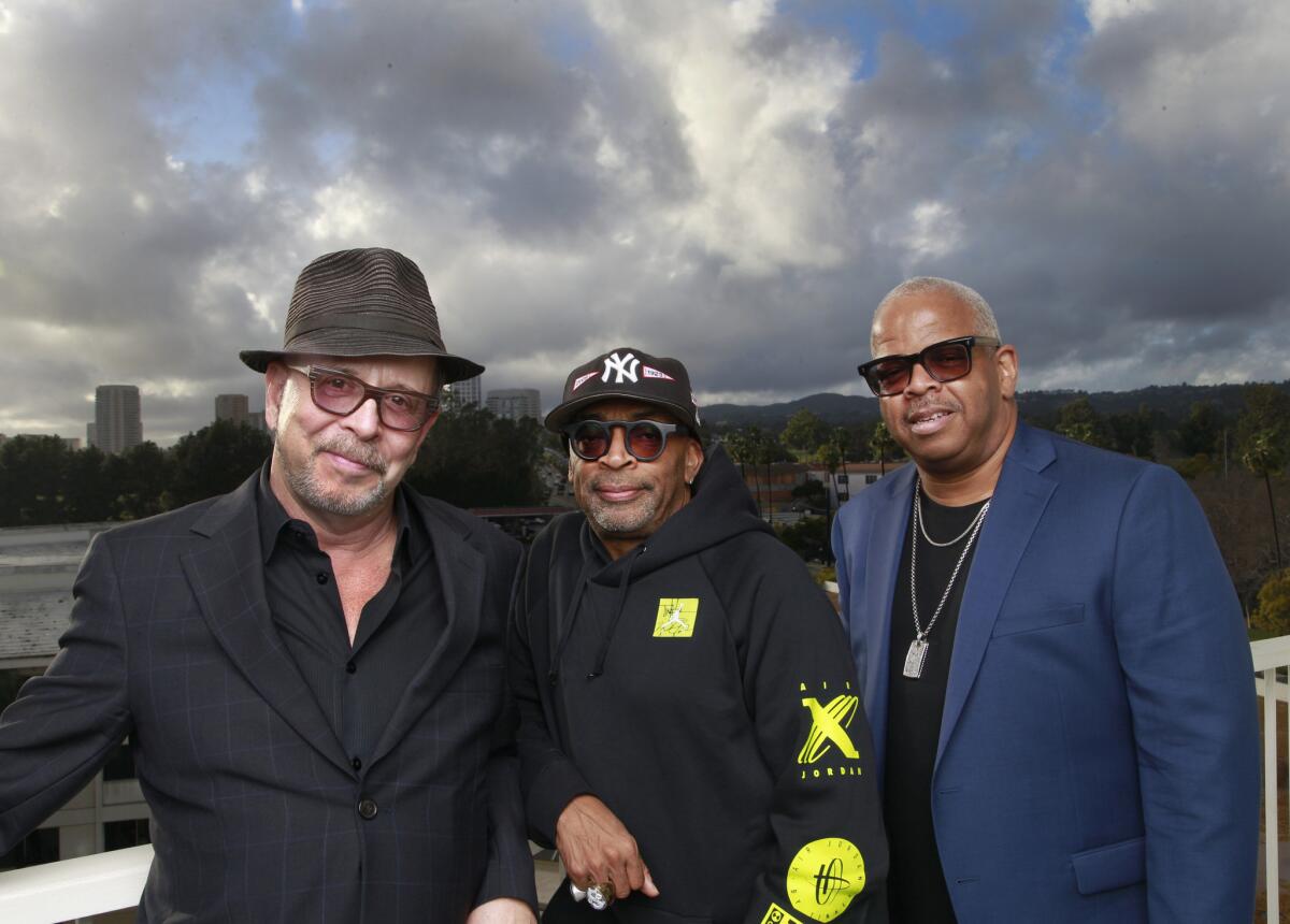 "This film ['BlacKkKlansman'] has connected the past with the crazy present day," says Spike Lee, center, with longtime collaborators Barry Alexander Brown, left, and Terence Blanchard.