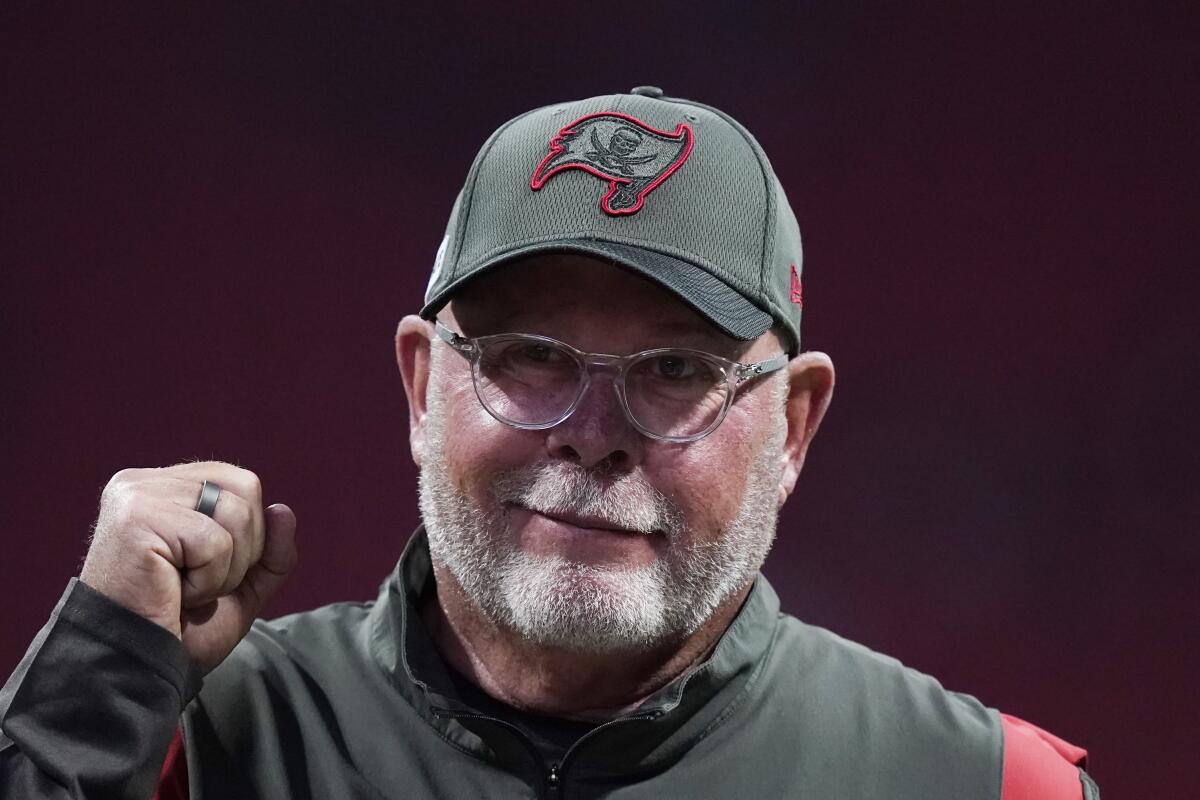 Bucs coach Bruce Arians walks on the sidelines before a game against the Falcons 