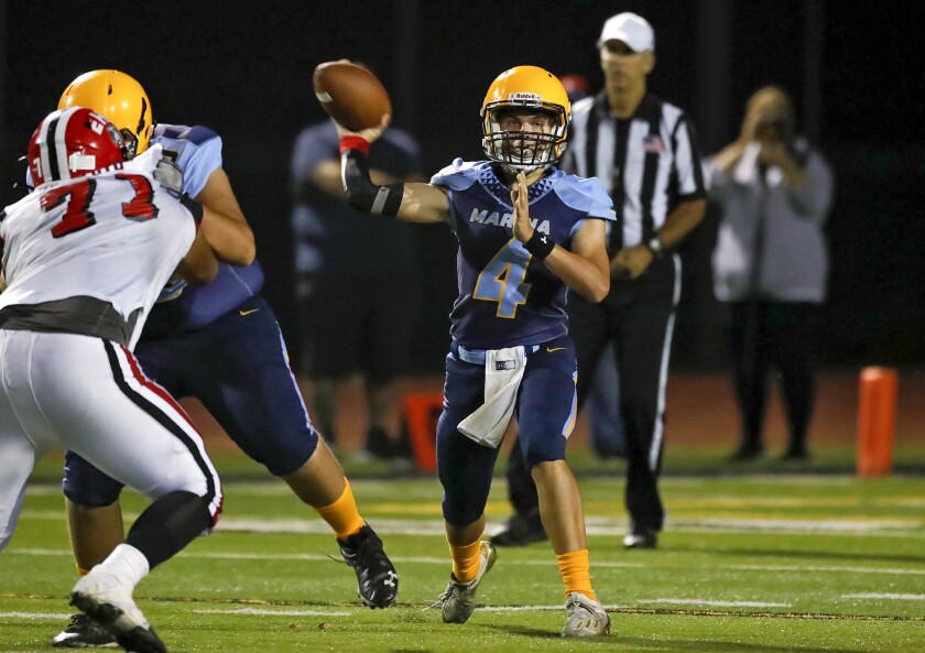 Marina quarterback Brock Beaver (4) throws a completion during a nonleague football game versus Elsinore at Boswell Field.