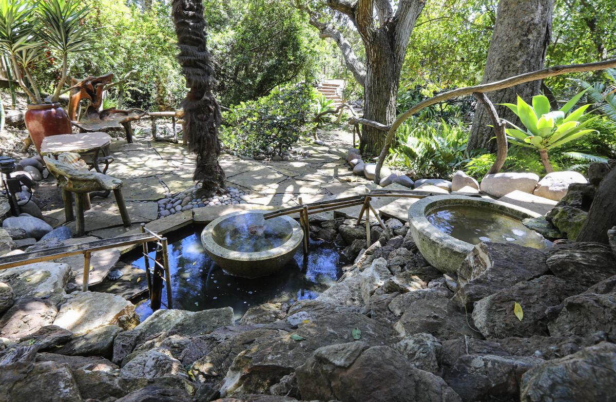 A double-bowl pond with dunker is one of the focal points in the garden of Anne and Jerry Ryan’s Point Loma home.