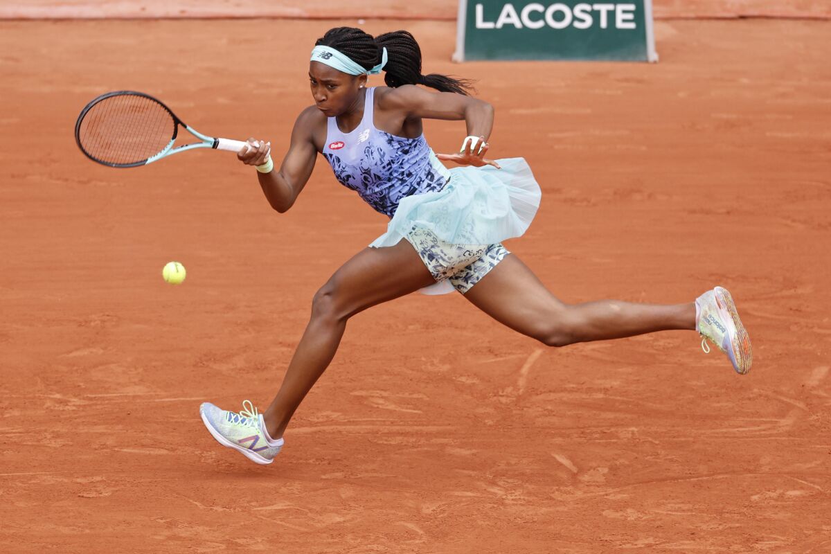 Coco Gauff of the U.S. returns the ball to Sloane Stephens of the U.S. during their quarterfinal match of the French Open tennis tournament at the Roland Garros stadium Tuesday, May 31, 2022 in Paris. (AP Photo/Jean-Francois Badias)