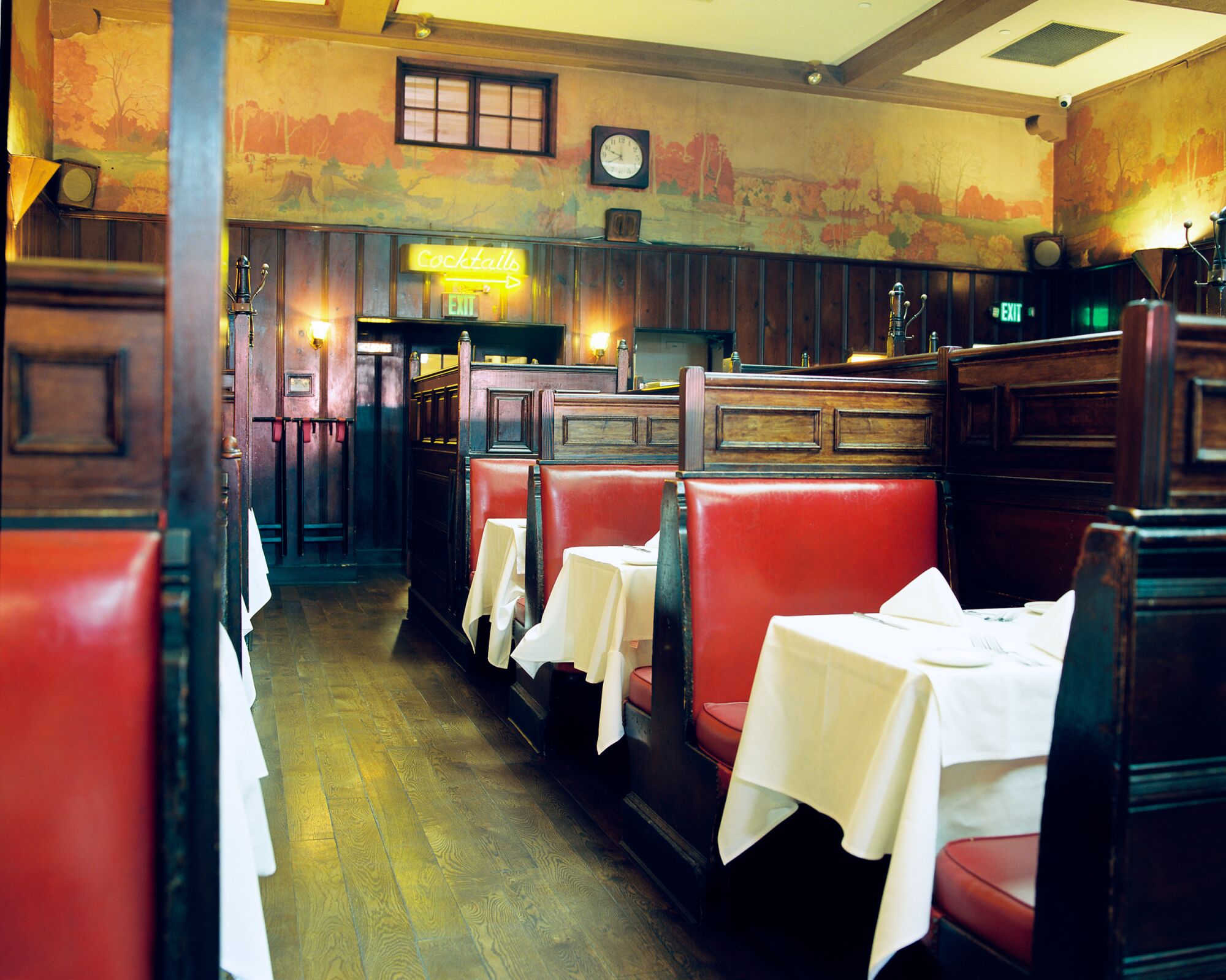 A photo of the red booths and white table cloths at Musso & Frank.