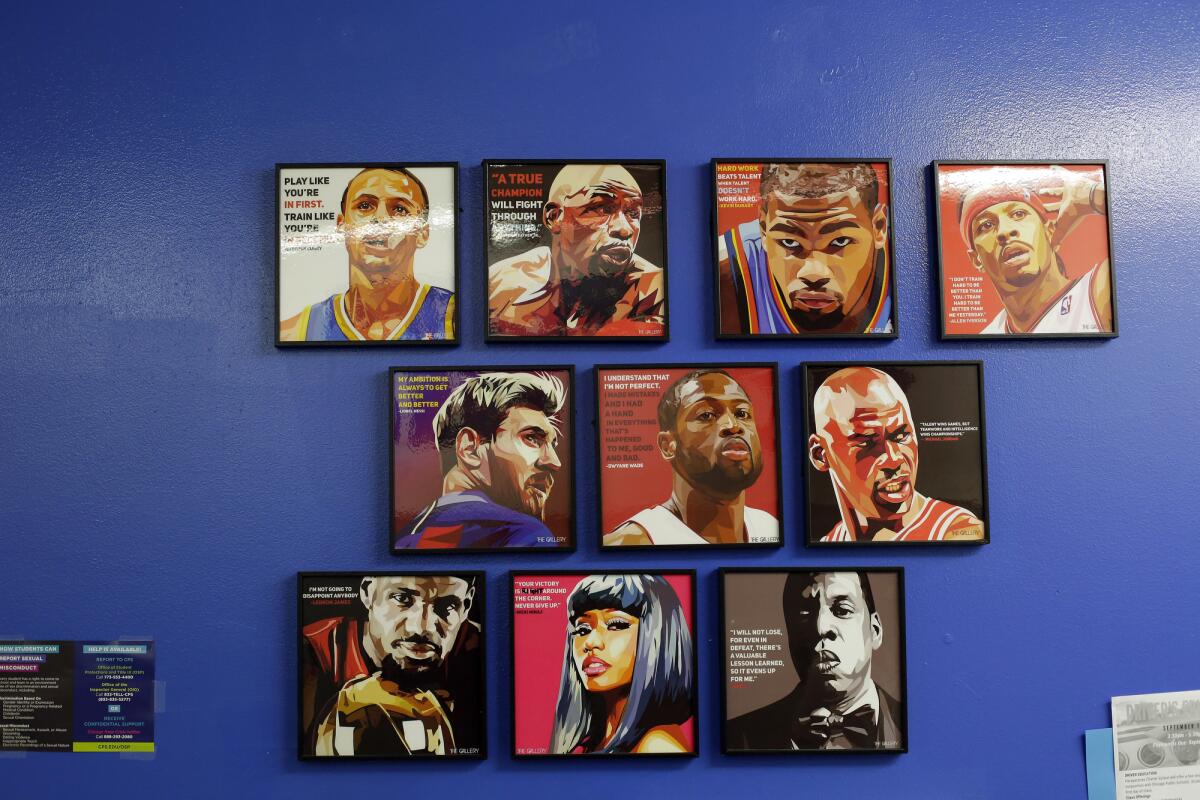 Portraits of athletes and entertainers on a wall at Perspectives Charter Schools'  Joslin Campus.