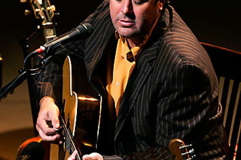 Singer-songwriter Vince Gill performs in a small-scale acoustic show at Walt Disney Concert Hall in Los Angeles.