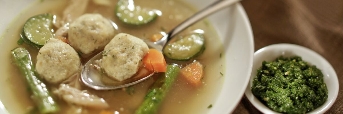 Sephardi Chicken Soup with Herb Flecked Kneidelach and zehug (chile garlic relish) 