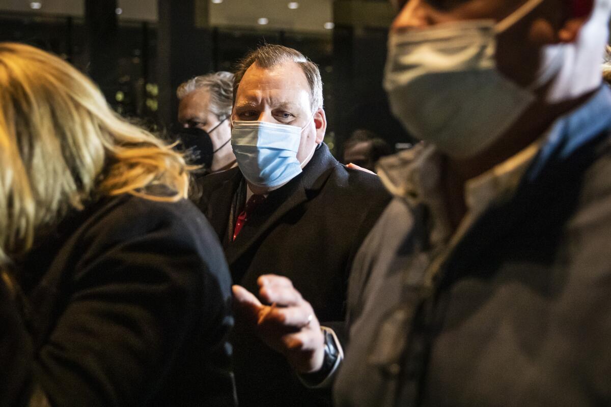 Alderman Patrick Daley Thompson walks with family members and supporters out of a federal courthouse in Chicago after being found guilty of tax crimes and making false statements, Monday, Feb. 14, 2022. (Ashlee Rezin/Chicago Sun-Times via AP)
