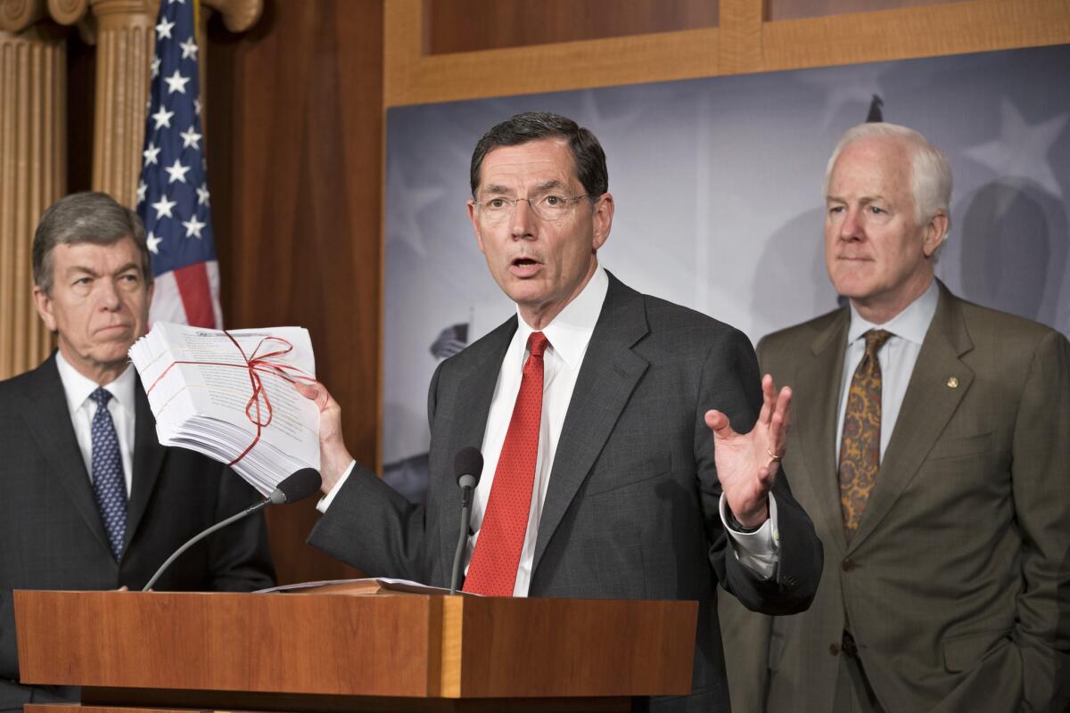 Sen. John Barrasso (R-Wyo.), center, accompanied by Sen. Roy Blunt (R-Mo.), left, and Senate Minority Whip John Cornyn (R-Texas), gestures during a news conference on Capitol Hill about the Affordable Care Act. GOP lawmakers on the Hill have been calling for a delay in the law's requirement that individual Americans carry health insurance.