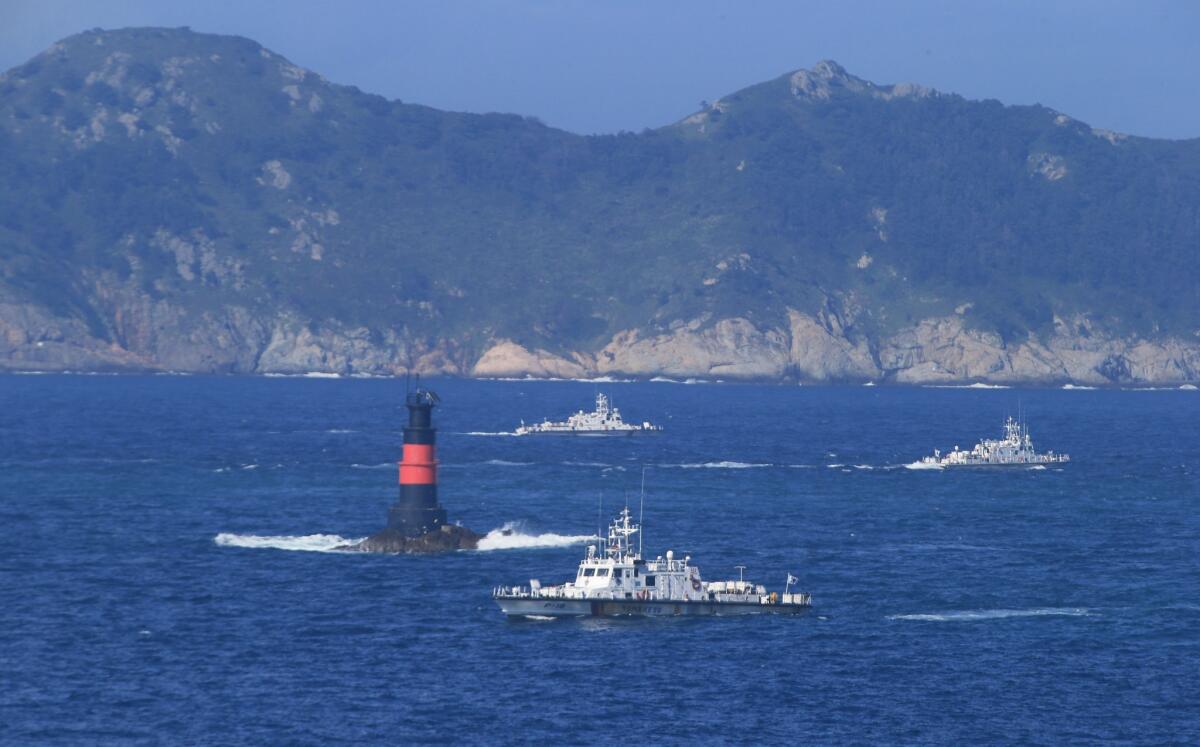 South Korean coast guard ships sail Sept. 6 to search for missing passengers who were on aboard a fishing boat that capsized off the resort island of Jeju.