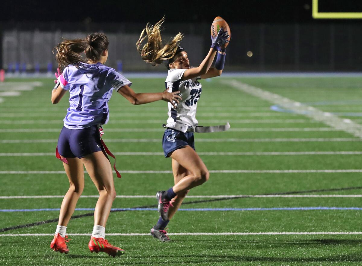 Newport Harbor's Skylie Cid (33) makes it into the end zone for a touchdown against Corona del Mar on Monday.