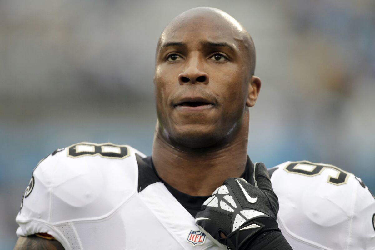 FILE - In this Sunday, Dec. 22, 2013, file photo, New Orleans Saints' Parys Haralson (98) is seen before an NFL football game against the Carolina Panthers in Charlotte, N.C. On Monday, Sept. 13, 2021, the San Francisco 49ers announced that Haralson, a former linebacker for the 49ers and New Orleans Saints, had died. He was 37. (AP Photo/Bob Leverone, File)