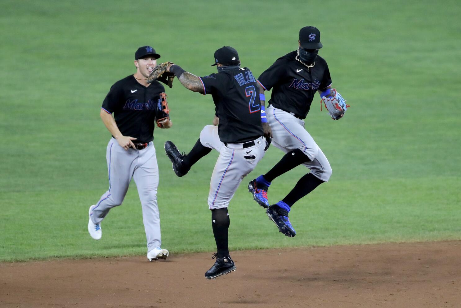 Miami Marlins Giancarlo Stanton waits his turn to hit during team