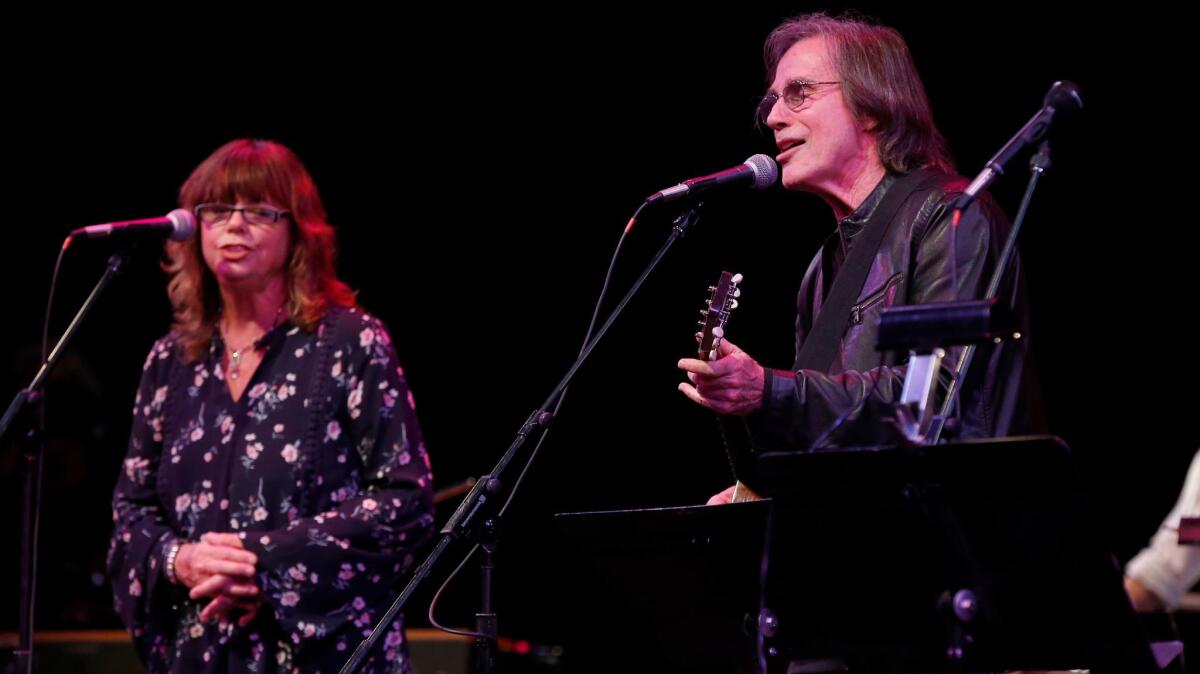 Susan Cowsill and Jackson Browne were among featured performers at Saturday's tribute to the Band in Glendale, a benefit for the Autism Think Tank. (Allen J. Schaben / Los Angeles Times)
