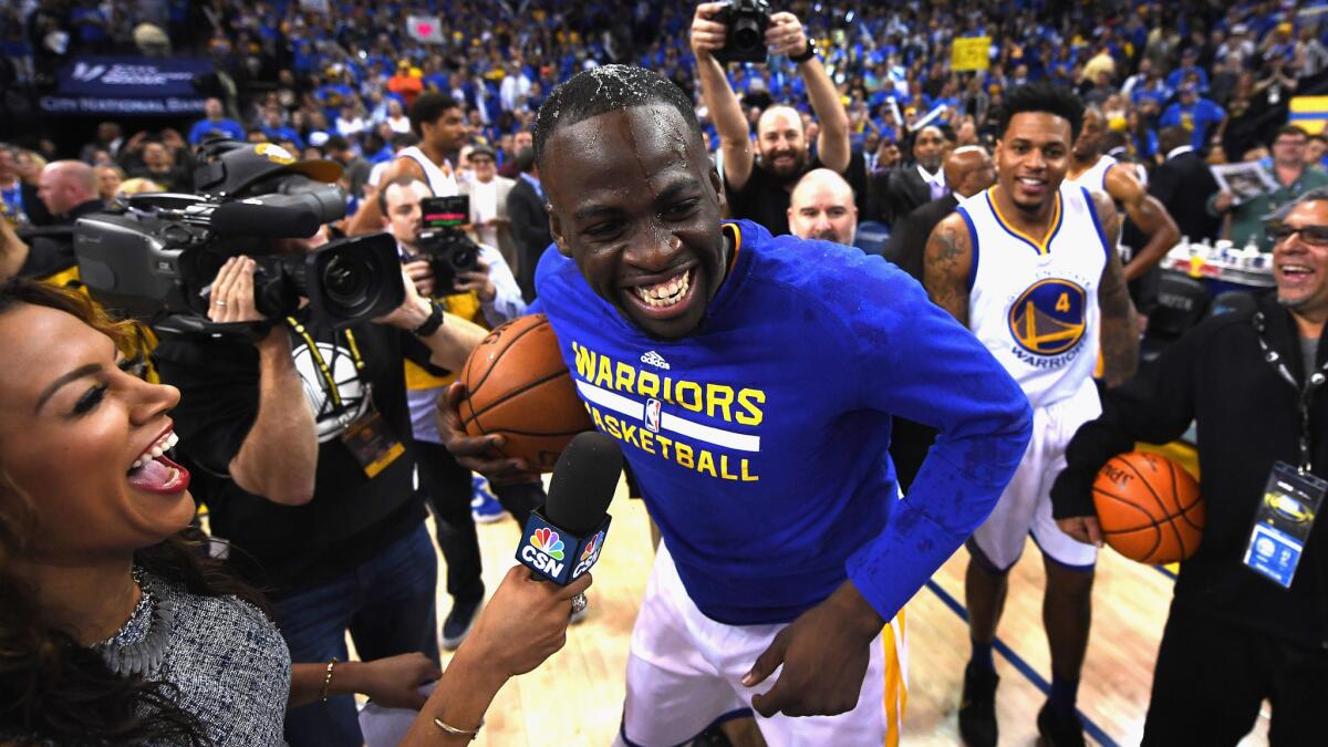 Warriors forward Draymond Green celebrates after the team's record-setting 73rd victory Wednesday night.