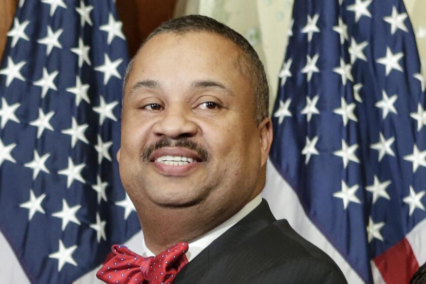 FILE - Rep. Donald Payne Jr., D-N.J., poses for a ceremonial photo in the Rayburn Room of the Capitol after the new 113th Congress convened, Jan. 3, 2013, in Washington. Payne Jr. of New Jersey died Wednesday, April 24, 2024, officials said, after suffering a heart attack earlier this month that had left him hospitalized. He was 65. (AP Photo/J. Scott Applewhite, File)