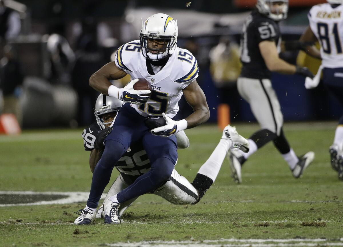 Chargers receiver Dontrelle Inman runs past Raiders cornerback David Amerson during a game in December 2015.
