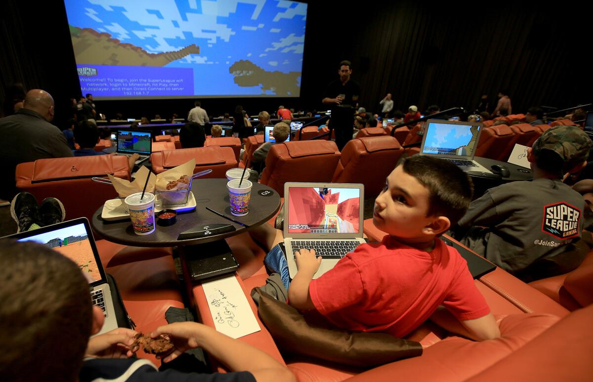 Fans of the computer game Minecraft gather at the iPic Theater in Westwood.