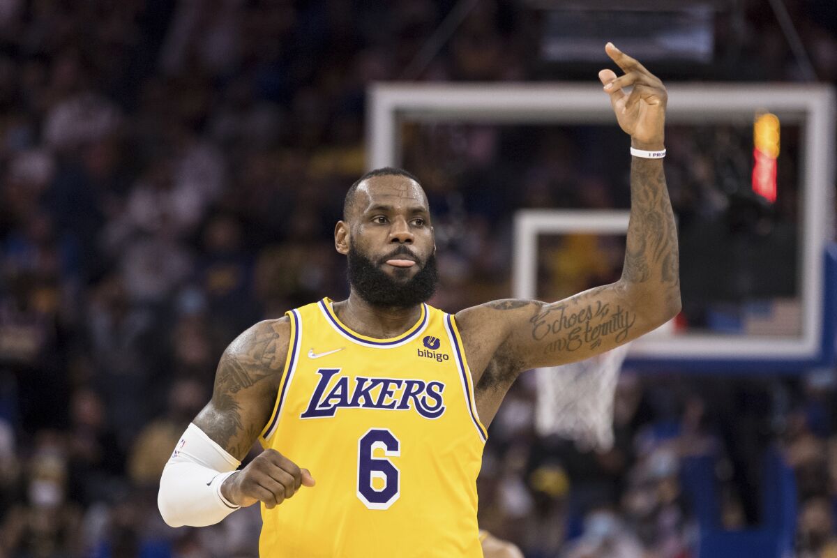 Lakers forward LeBron James makes a gesture during a game.