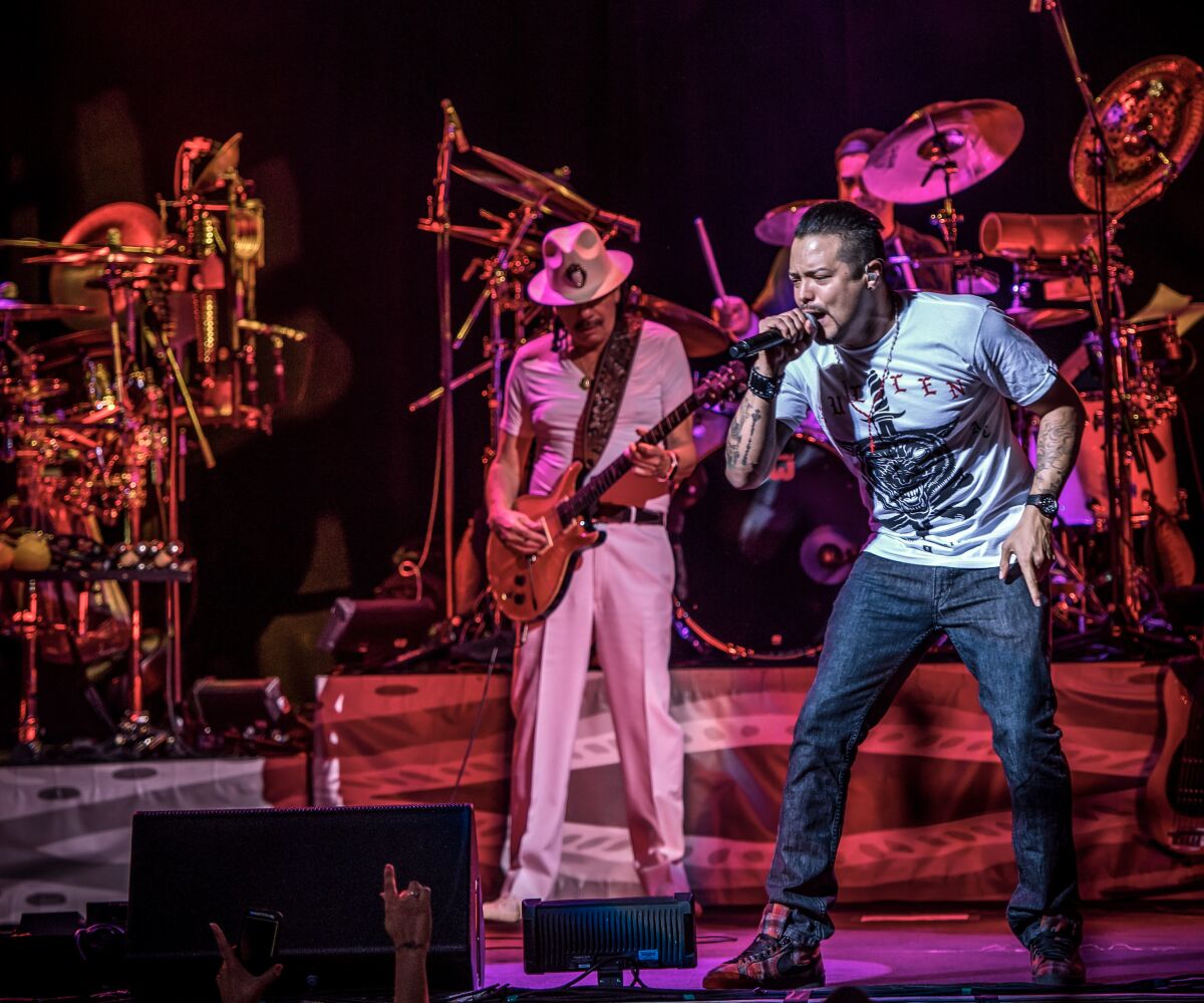 "I am really living a dream every day of of my life," says singer Andy Vargas (right) who joined Santana, the band by former Tijuana guitarist Carlos Santana, nearly 20 years ago. "Carlos is such an inspiration." 