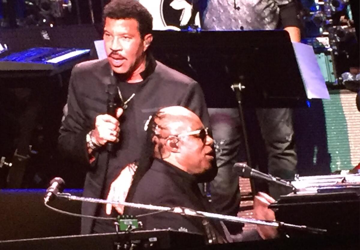 Lionel Richie joins Stevie Wonder at the House Full of Toys benefit in Los Angeles on Dec. 9.