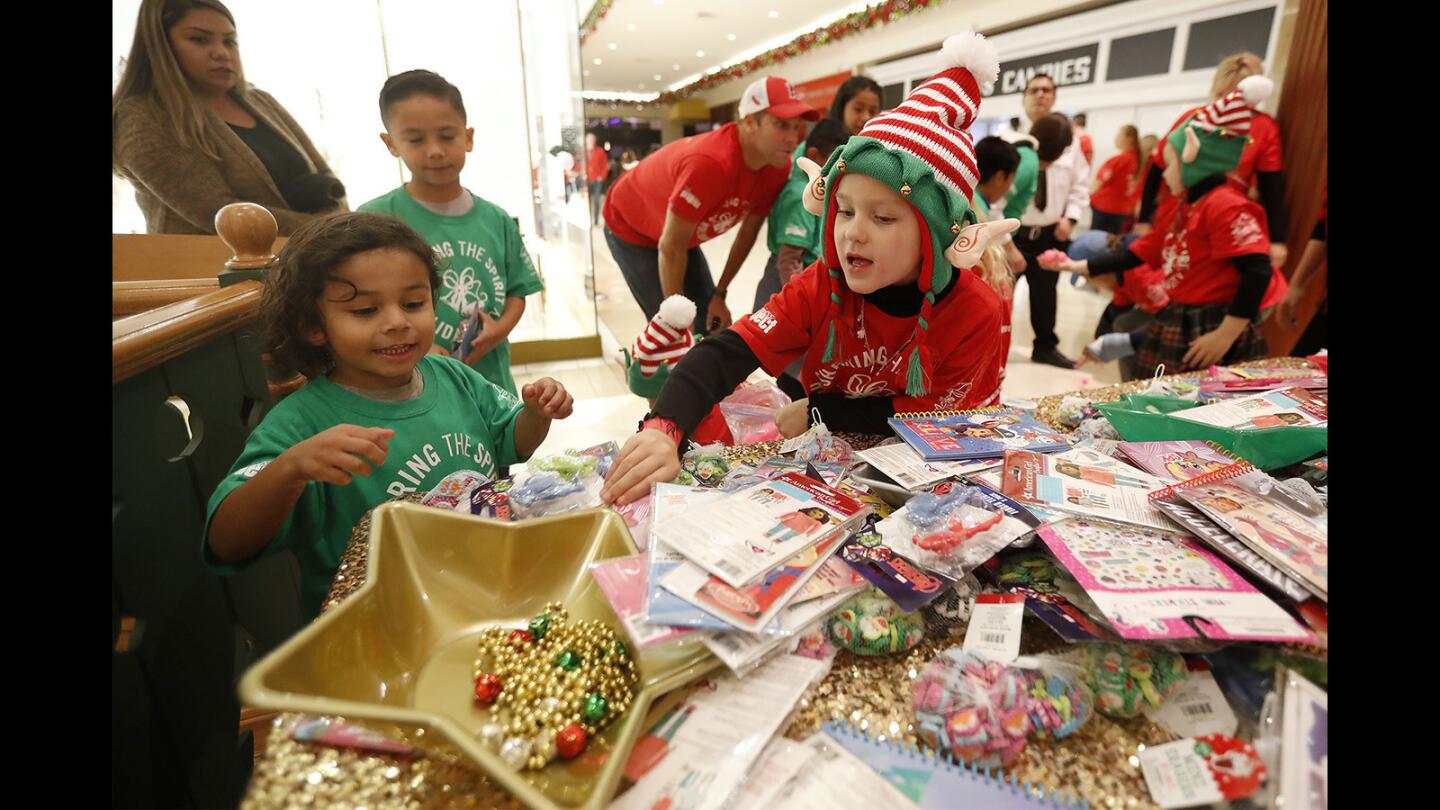 Photo Gallery: Eleventh annual “Sharing the Spirit Holiday Party” at South Coast Plaza