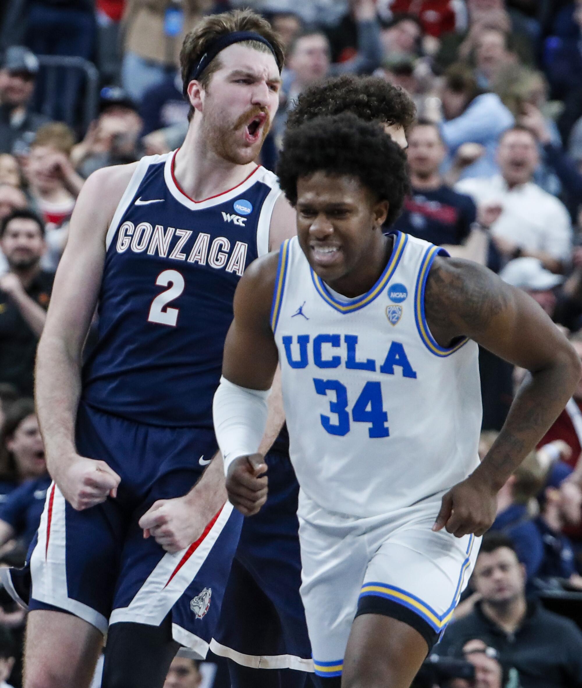 Gonzaga forward Drew Timme celebrates as UCLA guard David Singleton heads up court late in the game.