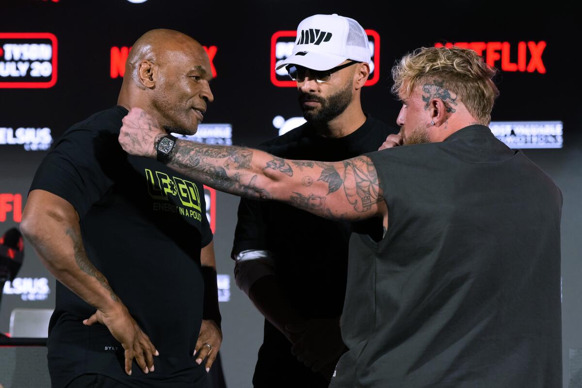 Mike Tyson, left, and Jake Pau 