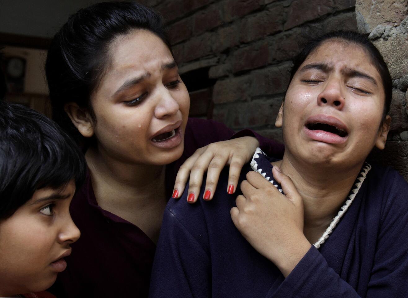 Christian girls mourn for a relative killed in the suicide bombing attack on Lahore churches.