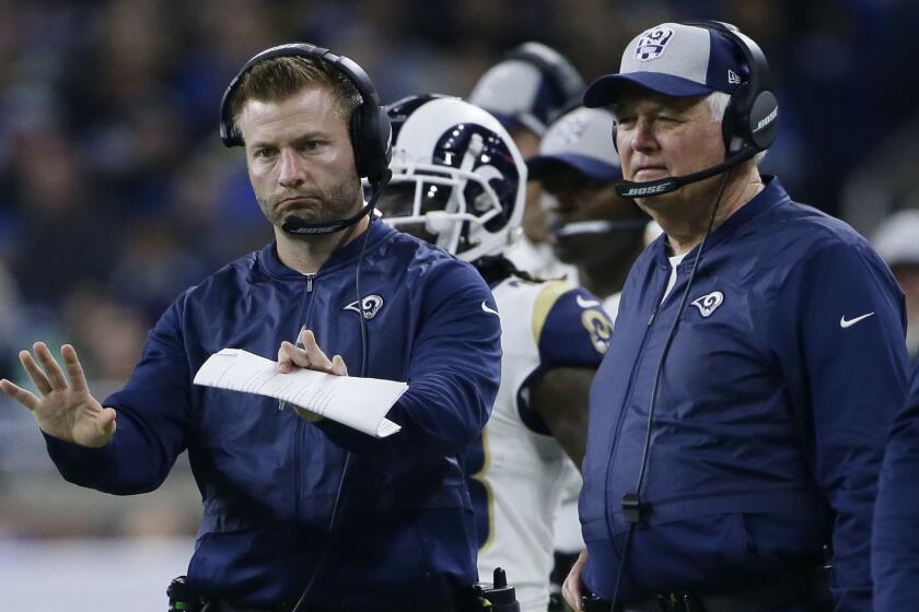 Los Angeles Rams head coach Sean McVay motions to his team with defensive coordinator Wade Phillips, right, during the second half of an NFL football game, Sunday, Dec. 2, 2018, in Detroit. (AP Photo/Duane Burleson)