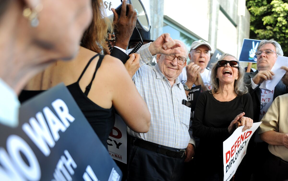 Actor Ed Asner, center, speaks to MoveOn members and allies in front of Rep. Lieu's office in Los Angeles during a rally to urge Lieu to support the Iran deal on Aug. 26.