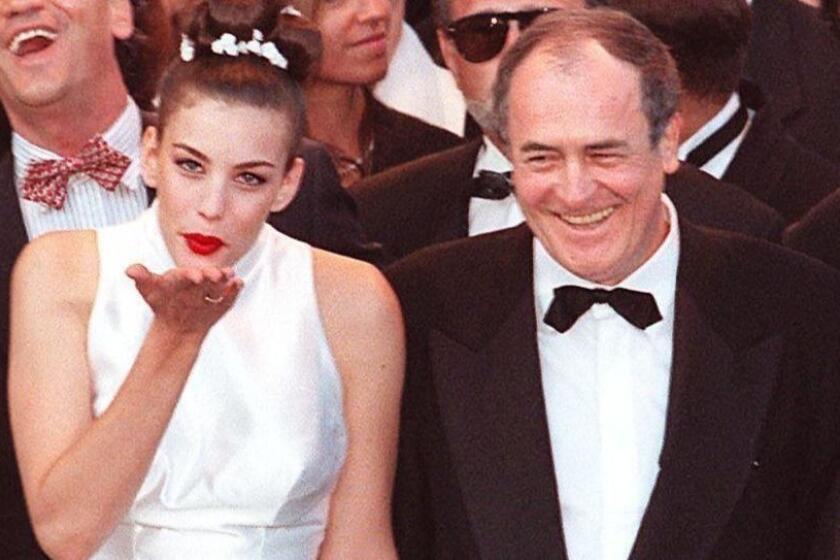 Mandatory Credit: Photo by ANSA/EPA-EFE/REX (9993156a) (FILE) - US actress Liv Tyler (L) with Italian film director Bernardo Bertolucci sends a kiss to the photographers at the Palais des Festivals of Cannes during the Cannes International Film Festival, in Cannes, France, 16 May 1996 (reissued 26 November 2018). According to media reports, Bertolucci has died at the age of 77 in Rome, after suffering from cancer. Bernardo Bertolucci dies at 77, Cannes, France - 26 Nov 2018 ** Usable by LA, CT and MoD ONLY **