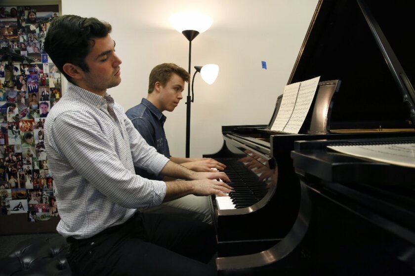 USC students Alex Biniaz-Harris, 21, left, and Ambrose Soehn, 22, play a piano suite they composed that they will perform in Krakow, Poland, next week at an event marking the 70th anniversary of the liberation of the Auschwitz concentration camp.