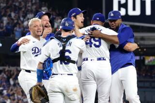 LOS ANGELES, CALIFORNIA - OCTOBER 11: Blake Treinen #49 of the Los Angeles Dodgers celebrates.