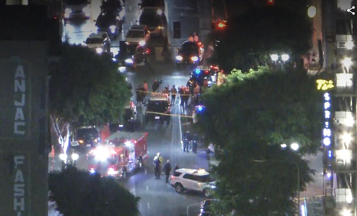 Aerial view of police cruisers and firetrucks on a downtown L.A. street