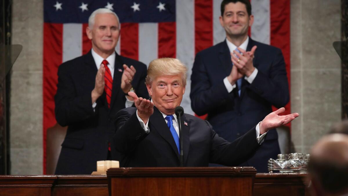 President Trump gestures as delivers his first State of the Union address.