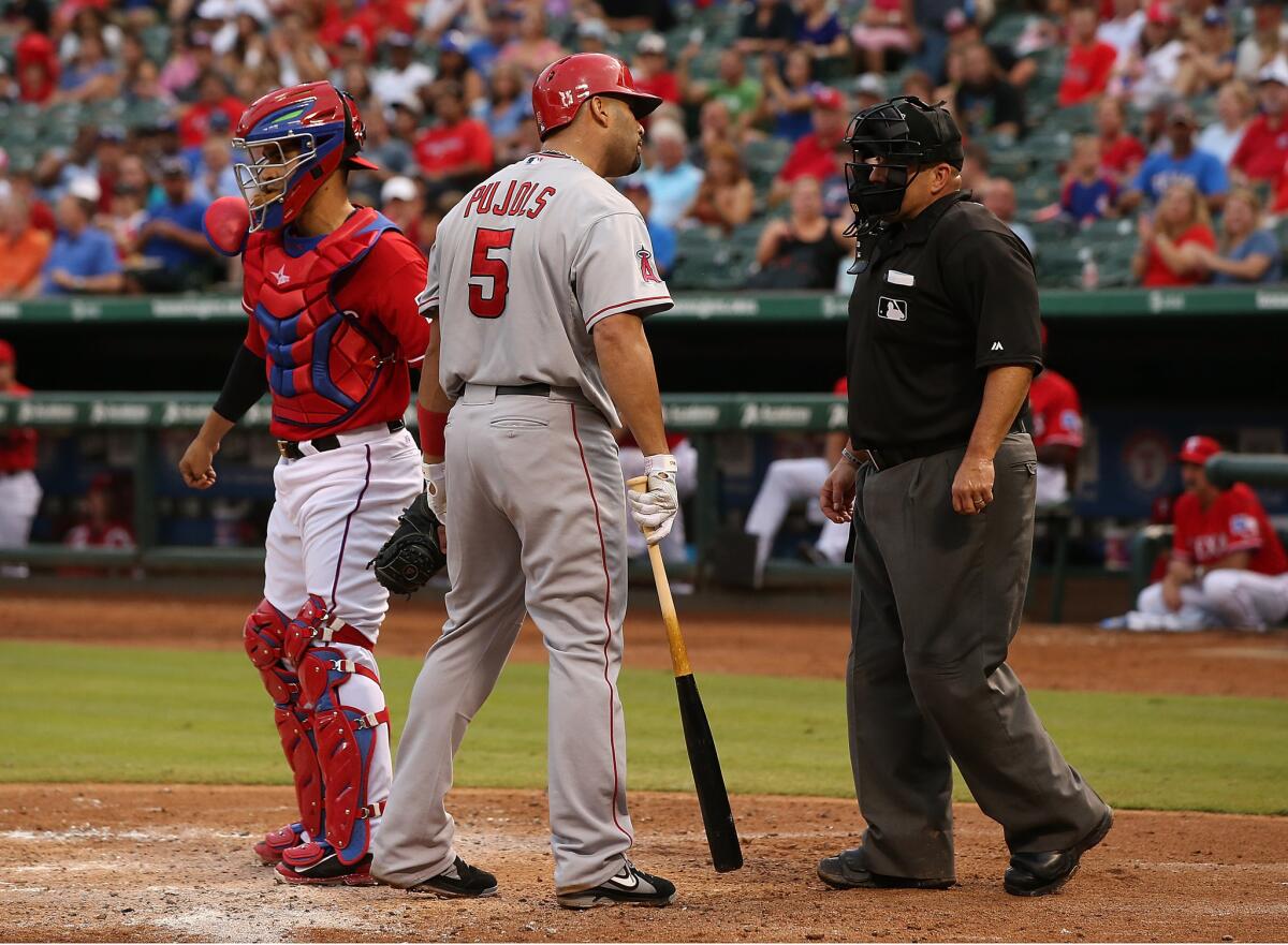 "Albert didn't like that call": Pujols reacts to a called third strike last month in Arlington, Texas.