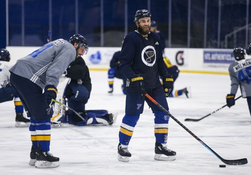 St. Louis Blues center Ryan O'Reilly (90) and Blues defenseman Robert Bortuzzo (41) joke around after NHL hockey practice at the Centene Community Ice Center in Maryland Heights, Mo., Monday, Jan. 4, 2021. (Colter Peterson/St. Louis Post-Dispatch via AP)