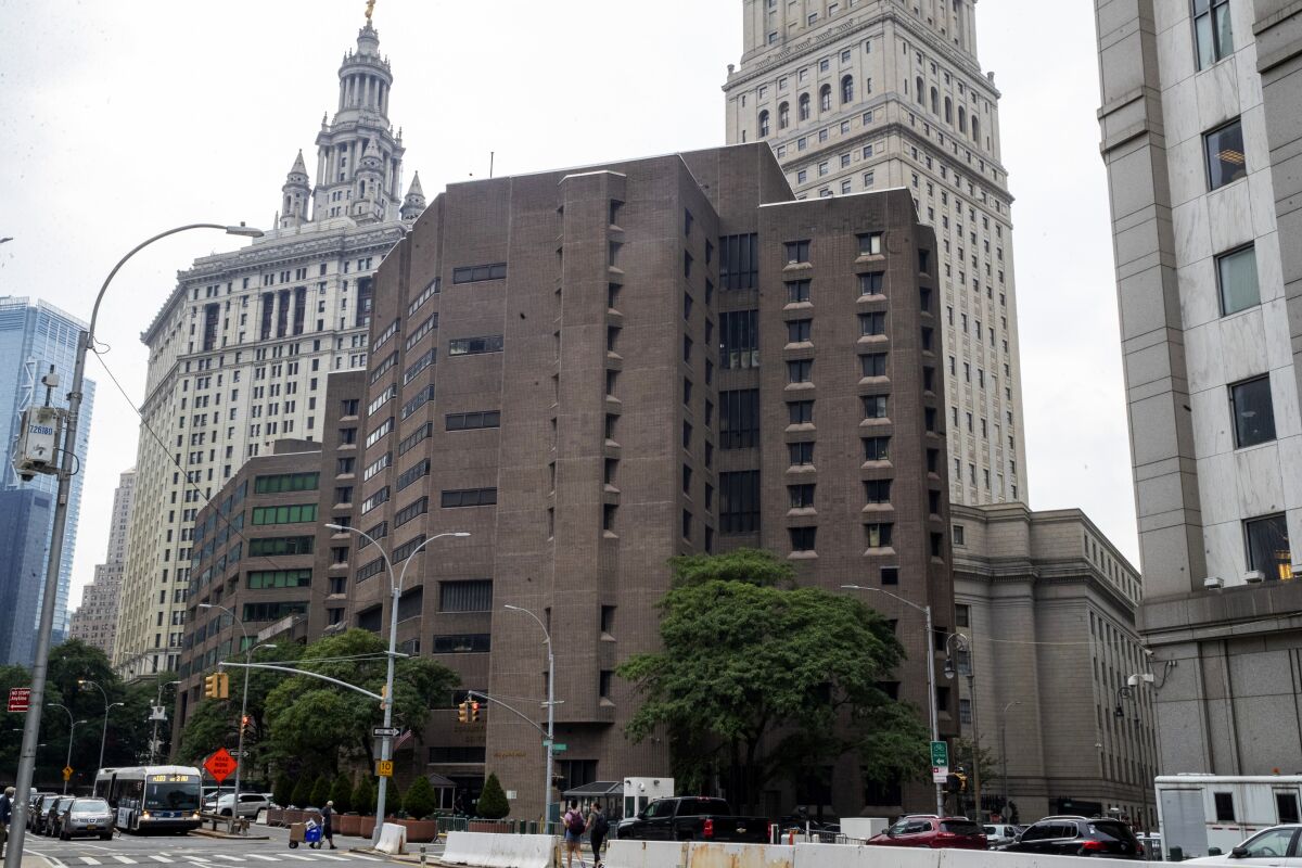 FILE - The now-closed Metropolitan Correctional Center in New York, Aug. 13, 2019. The warden who ran the beleaguered federal jail where disgraced financier Jeffrey Epstein killed himself quietly retired in February in the midst of a federal investigation into the failures that allowed one of the most high-profile inmates in the federal prison system to take his own life. Lamine N’Diaye retired from the Bureau of Prisons on Feb. 26, agency spokesperson Kristie Breshears told The Associated Press on Tuesday. (AP Photo/Mary Altaffer, File)