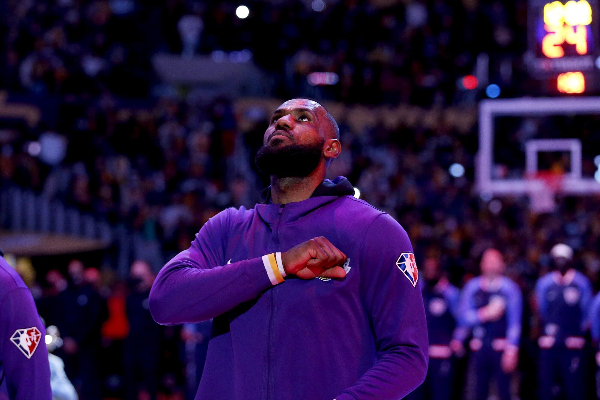 Lakers forward LeBron James thumps his chest before a Christmas Day game against the Brooklyn Nets.