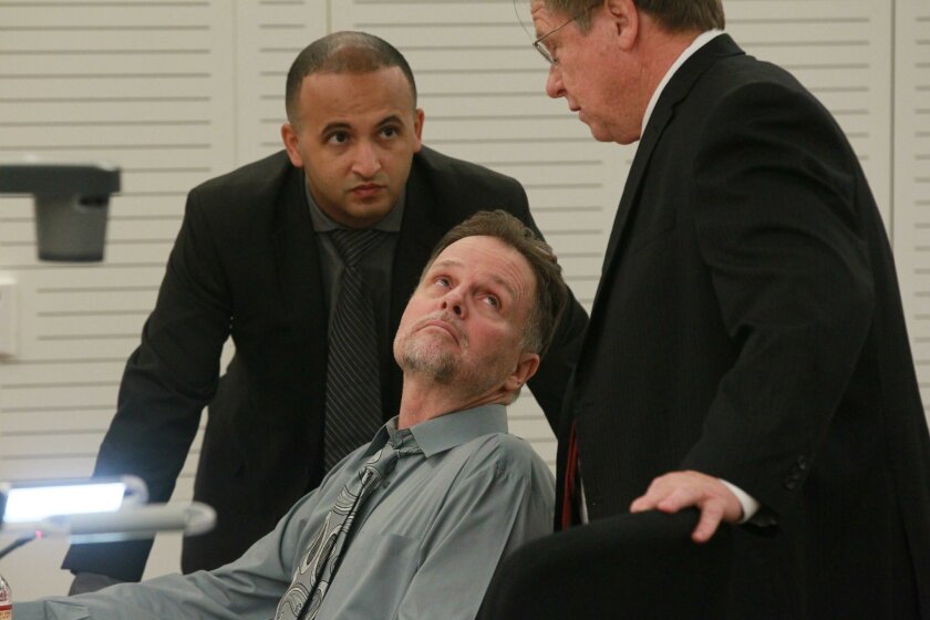 Murder defendant Charles “Chase” Merritt, center, with his then-defense attorneys Jim Terrell, right, and Jimmy Mettias, left, as Merritt’s preliminary hearing got under way in San Bernardino in June 2015.