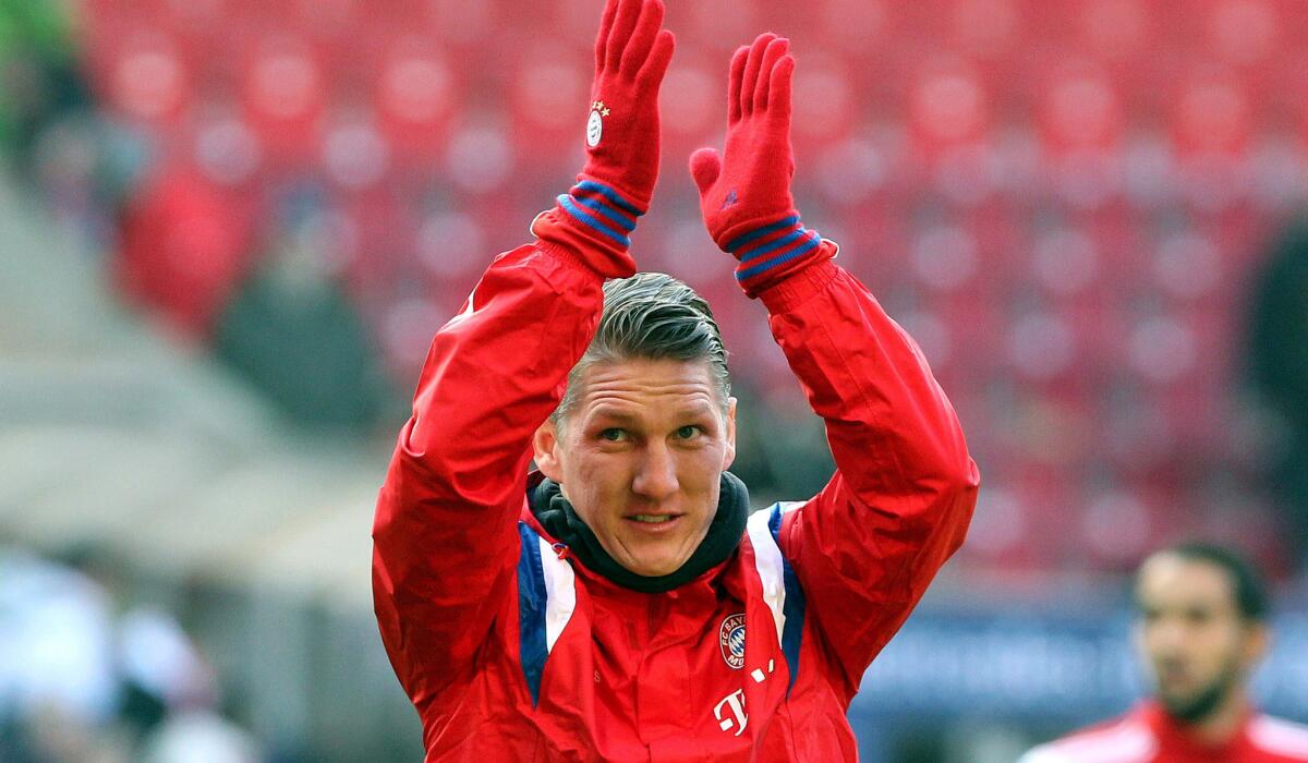 Bayern Munich midfielder Bastian Schweinsteiger acknowledges fans as he warms up for a German league game against VfB Stuttgart.