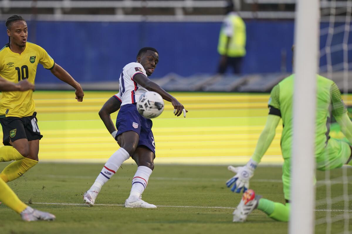 United States' Tim Weah scores his side's opening goal against Jamaica.