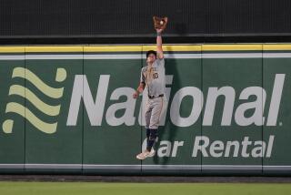 Milwaukee Brewers center fielder Sal Frelick catches a fly ball hit by Los Angeles Angels' Taylor Ward for the final out of a baseball game Tuesday, June 18, 2024, in Anaheim, Calif. (AP Photo/Ryan Sun)