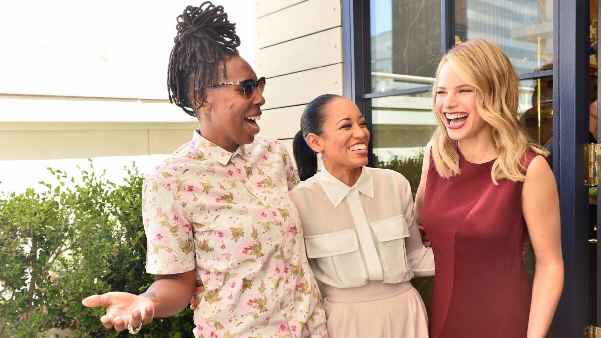 Emmy winner Lena Waithe of "Master of None," from left, chats with "Queen Sugar" star Dawn-Lyen Gardner and "Before I Fall" star Halston Sage during the Glamour and Tory Burch's "Women to Watch" lunch in Beverly Hills on Sept. 15.