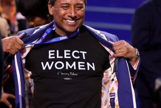 DNC CHICAGO, IL AUGUST 19, 2024 - California delegate Robert Camacho of Concord shows his t-shirt on the floor of the 2024 Democratic National Convention in Chicago on Monday, August 19, 2024 in Chicago, IL. (Robert Gauthier/Los Angeles Times)